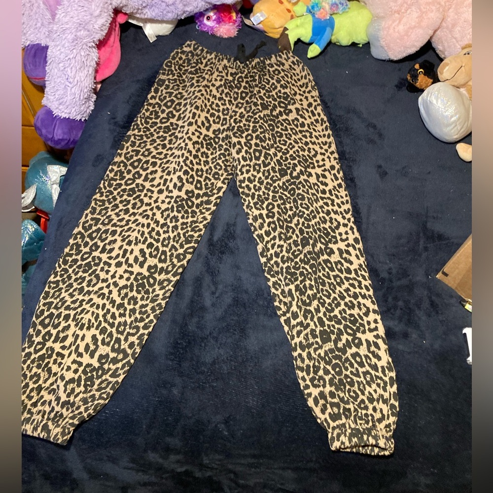 Dolls Kill “The Kirpt” cheetah print joggers